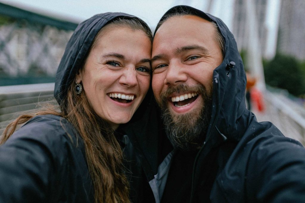 happy couple in rain jackets