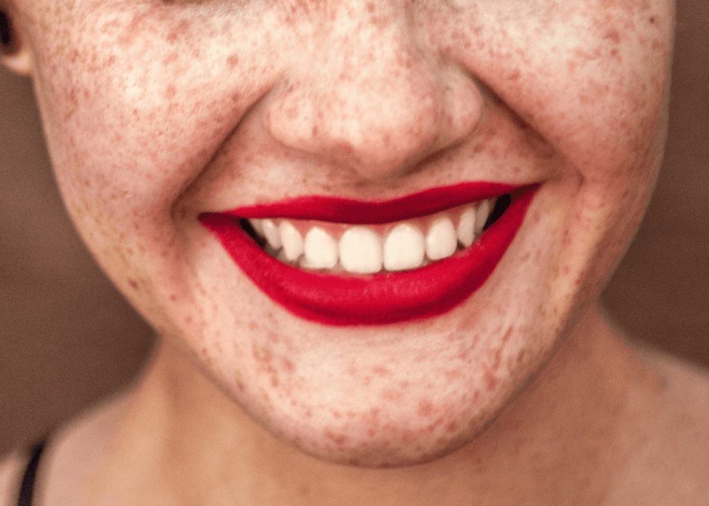 close up smile with red lipstick